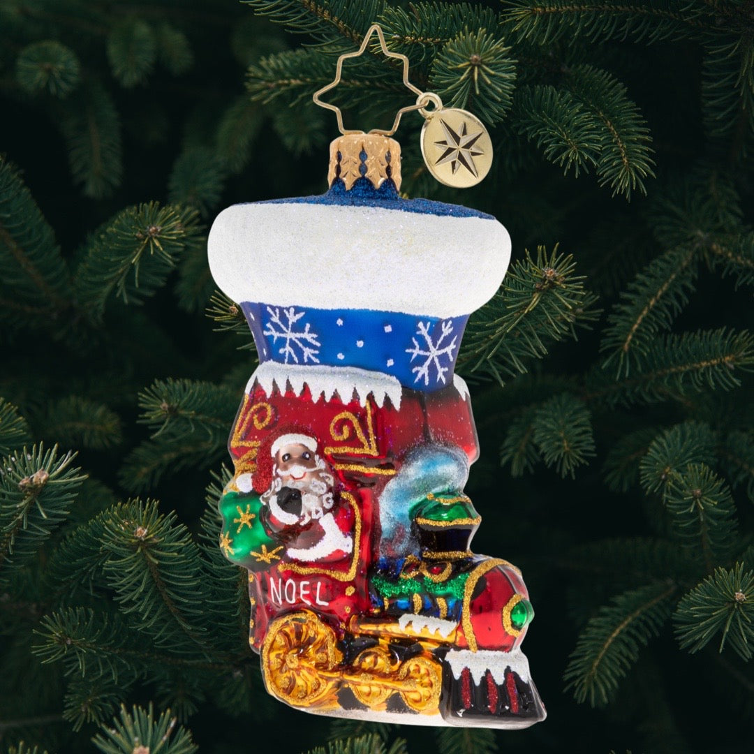 Ornament Description - Noel Express Stocking Gem: Look what just pulled into the station! It's the Noel Express, ready to whisk you away and take you on a Christmas vacation.