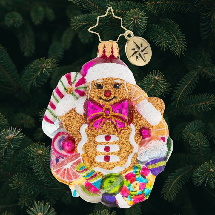 Ornament Description - Popping Out Surprise Gem: Surprise! The gingerbread man has arrived. And he's bursting with delight that Christmas is almost here.