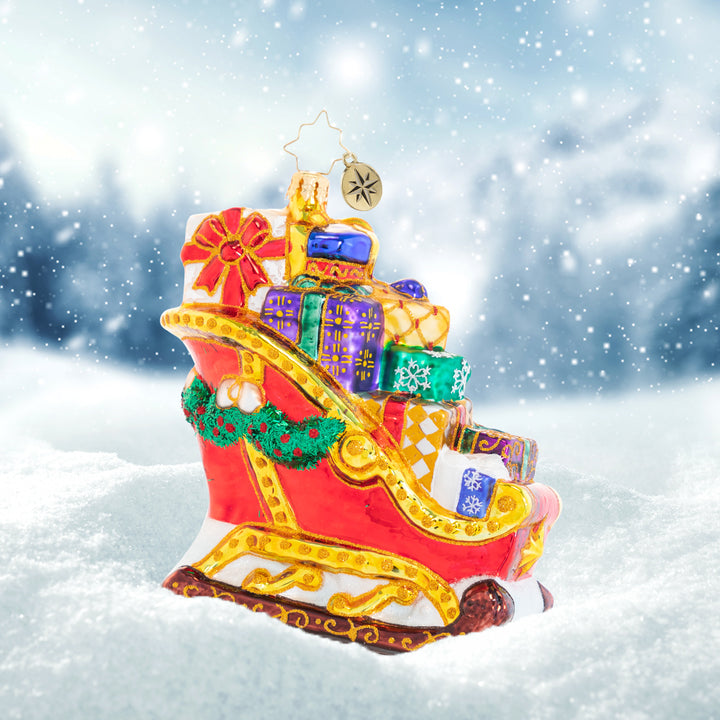 Ornament Description - Joyful Journey Sleigh: The reindeer sure do have their work cut out for them; this sleigh is seriously packed! Overflowing with gifts, it is going to be one seriously hefty haul, but they will do whatever it takes to get Christmas delivered on time!