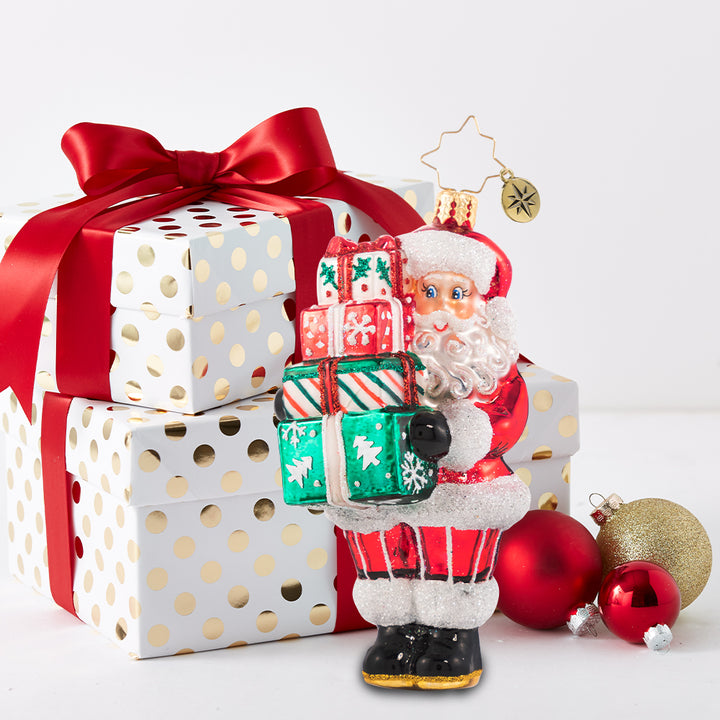 Ornament Description - Time To Celebrate!: Santa is in the spirit! He just could not wait to deliver these festive gifts. Do not worry, he will be back again on Christmas Eve!