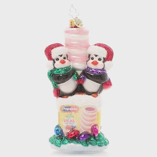 Video - Ornament Description - Popsicle Penguin Pals: Brrr! This pair of penguin pals is truly in their element atop a frosty box of Popsicle frozen treats. After all, they take "chilling" with friends very seriously at the North Pole! This video shows the ornament spinning slowly. 