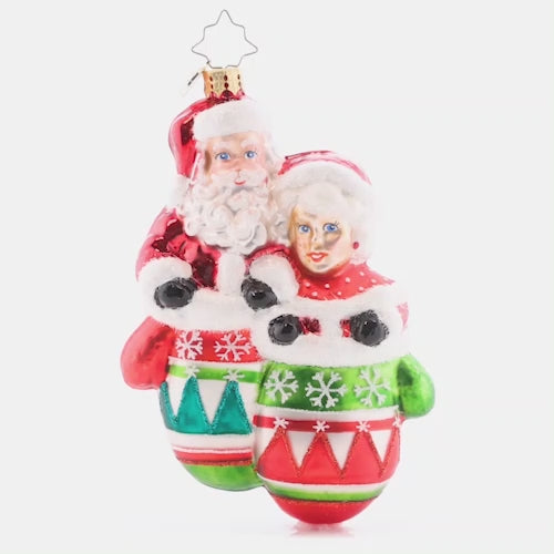 Video - Ornament Description - Christmas Couple: Mr. and Mrs. Claus are sure looking smitten, all cozy warm in a pair of mittens. With classic Christmas colors and detailed decoration, this wonderful ornament elicits elation.