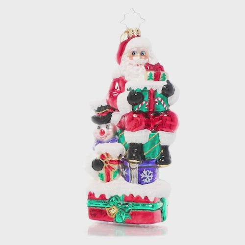 Video - Ornament Description - A Little Help From a Friend: Santa enlists the help of his snowman friend as he prepares for his Christmas deliveries. After all, that's what friends are for!