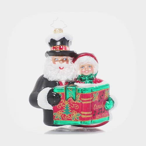 Video - Ornament Description - A Dazzling Duet: Mr. & Mrs. Claus team up for one of their favorite holiday traditions – Christmas caroling! They warm hearts and spread holiday spirit all over town with their music.