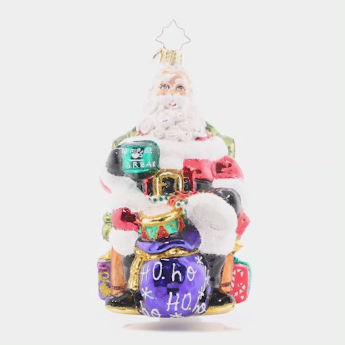 Video - Ornament Description - Break Time Santa: Hats off to a much needed coffee break! Santa takes a moment to sit back and relax with a steaming hot cup of joe before returning to his important present wrapping tasks.