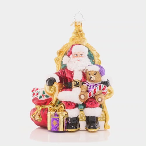 Video - Ornament Description - Strike A Pose Santa: Perfectly poised in a comfy chair surrounded by gifts, Santa is ready to listen to the Christmas wish lists from the good little girls and boys. This video shows the ornament spinning slowly. 