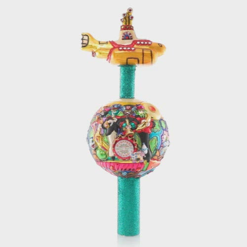 Video - Finial Description - Beatles On Top: Topping charts AND trees this year, the boys are back from the USSR and are taking Christmas to new heights! Their signature yellow submarine crowns this fun-filled finial.