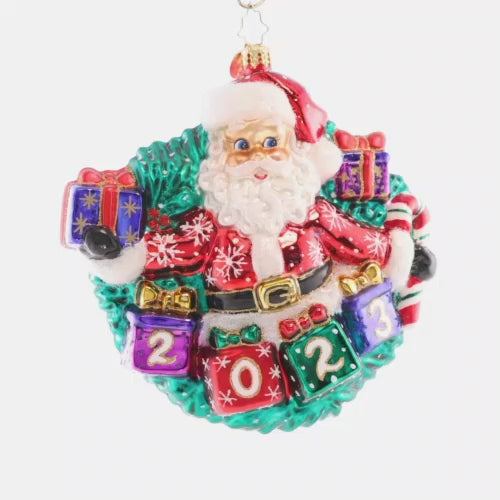 Video - Ornament Description - Yearly Salutations: With arms spread wide full of Christmas cheer, Santa is looking ahead to an extra bright year! Adorn your tree with this darling dated piece. This video shows the ornament spinning slowly. 