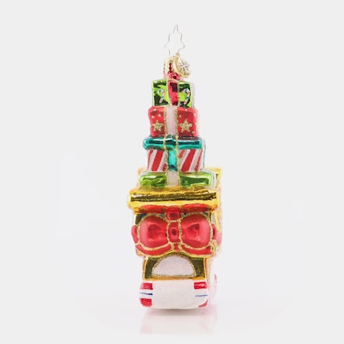 Video - Ornament Description - Piled-High Sleigh: Look at that perfectly-stacked plethora of presents! This super-stocked sleigh is ready to save Christmas day, ensuring that Santa can get all of the gifts delivered swiftly around the world. This video shows the ornament slowly spinning. 