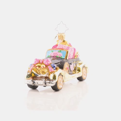 Video - Ornament Description - Just Married Roadster: If you see this heart-covered automobile driving down the road, you know what that means… A happy couple just got hitched! Honor the newlyweds in your life with this sweet ride. This video shows the ornament slowly spinning. 