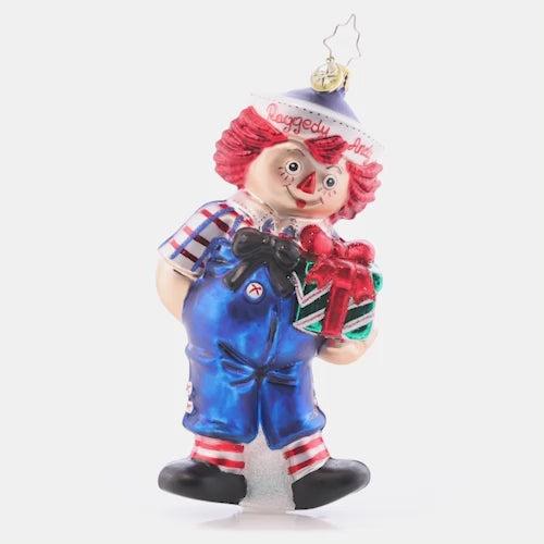 Video - Ornament Description - Raggedy Presents: The classic doll that everyone remembers comes to life this Christmas, with a bright smile and hope for jolly good holiday. Raggedy Andy even brought a present to place under the tree! This video shows the ornament slowly spinning.