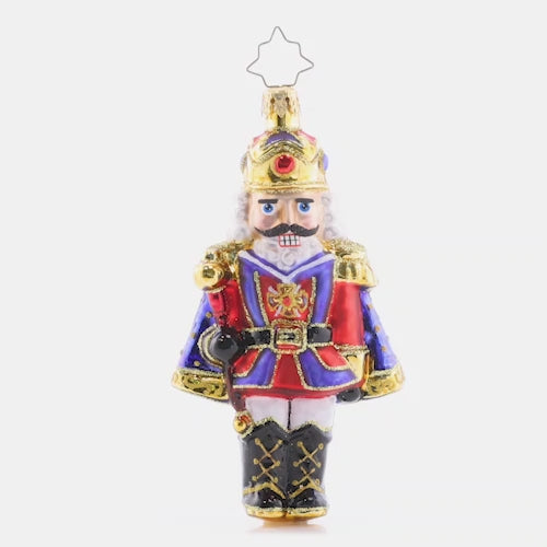 Video - Ornament Description - Christmas Classic 'Cracker: Time to get crackin' on some present unwrapping! This classic nutcracker is ready to celebrate, marvelously mustachioed and donning a red and blue cloak.