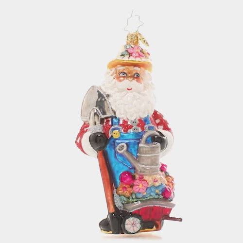 Video - Ornament Description - Santa's Garden: Christmas might be Santa's favorite season, but Spring is definitely a close second! After lovingly tending to his flower patch for weeks and weeks, he stands proudly with his blooming garden bounty, ready to share with friends. This video shows the ornament spinning slowly. 