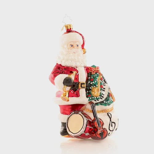 Video - Ornament Description - Holiday Seranade: Santa is ready to perform all your favorite holiday tunes! He is sure to have you Jingle Bell Rockin' around your Christmas tree all season long. This video shows the ornament slowly spinning. 