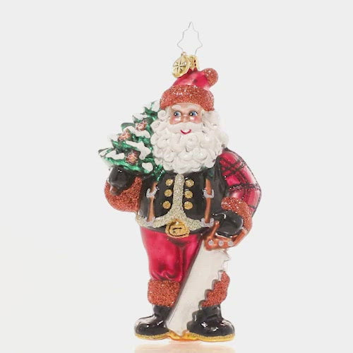 Video - Ornament Description - Winter Woodsman Santa: Santa has spent all day trekking through the snowy North Pole woods in search of the perfect Christmas tree for the Claus household…and he's finally found the one! He poses proudly with his selection slung over his shoulder. Now it's time to decorate! This video shows the ornament spinning slowly. 