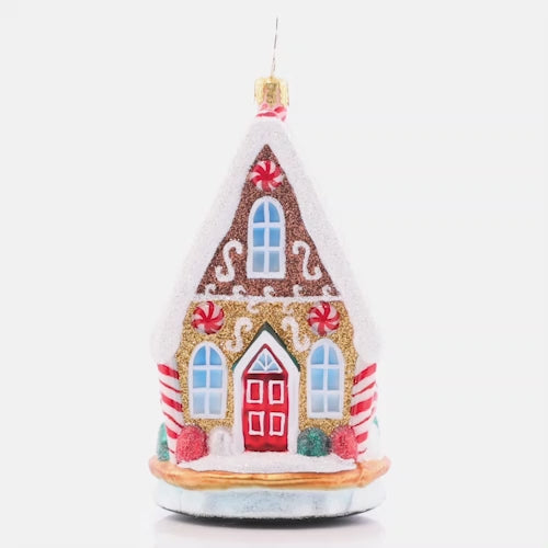 Video - Ornament Description - Sweetest Chalet: That's one cozy-looking cookie chalet! Adorned with snow made of icing, gooey gumdrops, and peppermint accents, this little house sure sweetens up the neighborhood. This video shows the ornament spinning slowly. 