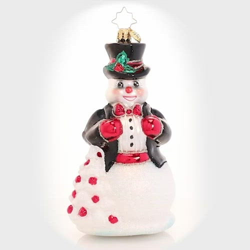 Video - Ornament Description - High-Fashion Frosty: In his top hat and tails, Frosty is dressed to impress. He is all spiffed up for the North Pole Christmas ball and is looking for love. Will tonight be the night his Christmas wish comes true? This video shows the ornament spinning slowly. 