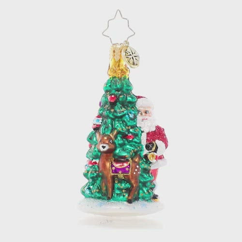 Video - Ornament Description - Two Talented Tree Trimmers: Time to deck the halls! Enlisting the help of his reindeer companion, Santa trims the North Pole Christmas tree in his favorite heirloom ornaments. This video shows the ornament spinning slowly. 