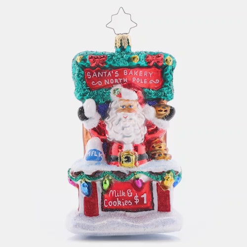 Video - Ornament Description - Santa's Sweet Treat Stand: After sampling Christmas cookies from around the world, Santa has worked out the tastiest secret recipe. Stop by his cookie stand for a sweet treat and a tall glass of milk, and get into the holiday spirit! This video shows the ornament spinning slowly. 