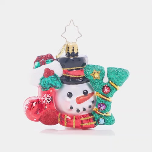 Video - Ornament Description - A Joyful Holiday Gem: You can't spell "jolly" without J-O-Y! A similing smowman peeks out from this joyous Little Gem, which spells out the spirit of the holiday season.