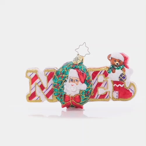 Video - Ornament Description - Christmas Traditions Noel: Spelling the traditional name for "Christmas" in sweet gingerbread and peppermint, this Noel ornament is the perfect way to celebrate the special day.