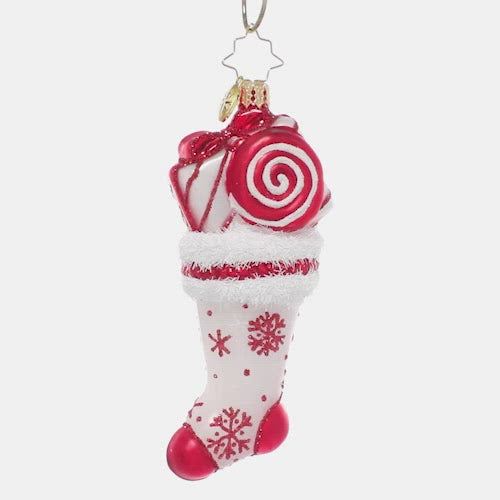 Video - Ornament Description - Peppermint Swirl Stocking: This glittering red & white stocking is stuffed full of sweet surprises! Peppermint swirls, lollipops and candy canes make it an extra special treat. Wonder what other fun things might be inside? This video shows the ornament spinning slowly. 