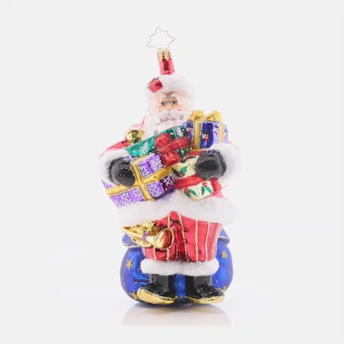 Video - Ornament Description - Carrying Christmas: As you can tell by his arms overflowing with gifts, Santa has his hands full this year! Not to worry, he'll get those gifts down the chimney in a hurry.