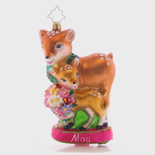 Video - Ornament Description - Celebrate All Moms: This darling mama doe and her baby deer share a sweet moment, sniffing spring flowers together. The fifth piece in our Ornament of the Month collection is just as sweet as the mothers it honors!