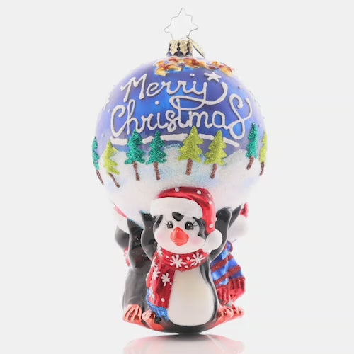 Video - Ornament Description - A Lotta Help From My Friends: These penguins know, teamwork makes the dream work! Three flightless friends work together to hold up a beautiful ornament round, decorated with a snowy scene of Santa flying through the night sky.