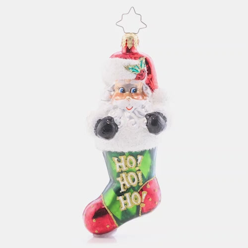 Video - Ornament Description - Stocking Stuffed Santa: Surprise! This Santa-stuffed stocking is the most perfect gift of all. Decorated with green argyle and Santa's signature jolly laugh, this ornament is sure to bring joy to your tree this year. This video shows the ornament spinning slowly. 