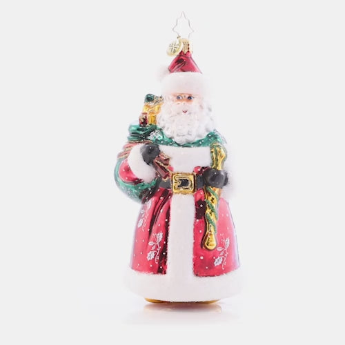 Video - Ornament Description - Brant's Brilliant Santa: In a traditional red robe speckled with snowflakes and holly, this Santa is just like his designer, Brant Moll- Keeping it classic, but with a hint of flair!