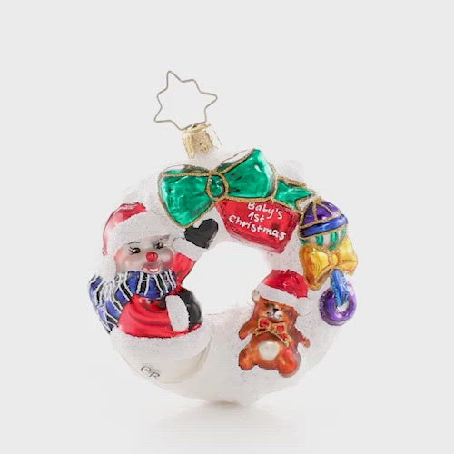 Video - Ornament Description - What Wonders Await Wreath Gem: A baby makes days shorter, nights longer, a home happier, and love stronger. The best is yet to come! Dedicate your newest arrival with this wee wreath of wonders! This video shows the ornament spinning slowly. 