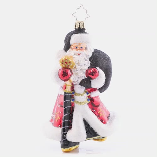 Video - Ornament Description - Jolly Jewel-Toned Santa: Jauntily-dressed in a jewel-toned jacket and stylish black hat, Santa strolls along to make his next gift delivery! Sure to stand out, add this unique piece to your ornament collection this year. This video shows the ornament slowly spinning. 