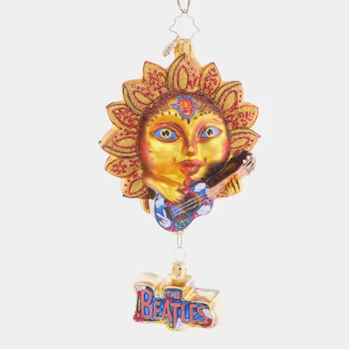 Video - Ornament Description - The Beatles' Sun King: The sun is up, the sky is blue, and this mystical musician has a tune for you. Across the universe, his sweet song rings out, making the whole world twist n' shout. And before he sets, he pleads, "remember: love is all you need." This video shows the ornament spinning slowly. 