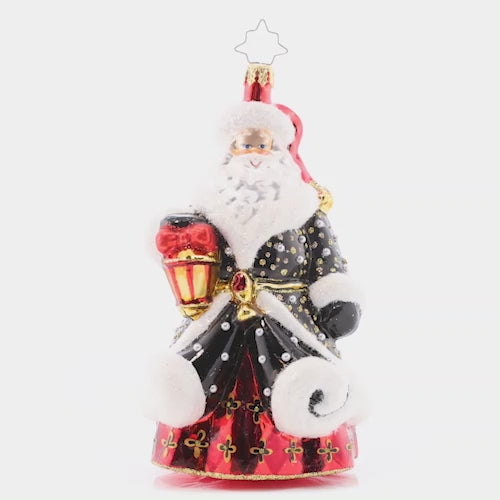 Video - Ornament Description - Golden Glow Santa: Santa's black robe is studded with silver and gold, resembling a starry sky on a cold winter night. He's got his trusty lamp to light the way this holiday season. This video shows the ornament slowly spinning. 