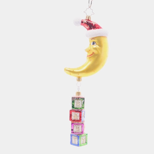Video - Ornament Description - To The Moon and Back: With classic, colorful baby blocks and a shining crescent moon, this ornament is the perfect way to celebrate your littlest loved one this holiday season. This video shows the ornament spinning slowly. 