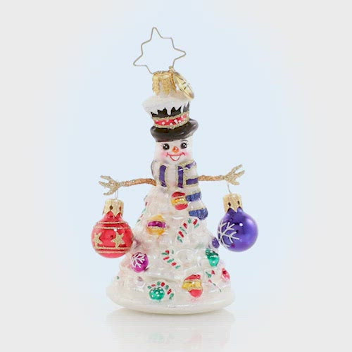 Video - Ornament Description - Quite a Lively Tree Gem: Who needs a tree? Not our snowman friend, that is for sure! He is decked out for the season in his Christmas best, with arms outstretched for frosty holiday hugs! This video shows the ornament spinning slowly. 
