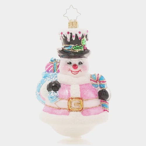 Video - Ornament Description - Pink Peppermint Snowman: The snow is falling! This snowman is all dressed up for his favorite season of all in a pale pink outfit with light blue accessories.  This video shows the ornament spinning alowly. 