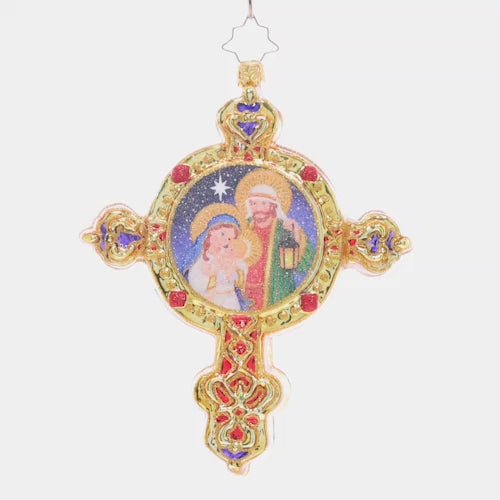 Video - Ornament Description - Radiant Guiding Light: This gleaming golden cross features the beautiful scene of baby Jesus, Mary, and Joseph – a piece that celebrates the beauty of Christmas. This video shows the ornament spinning slowly. 