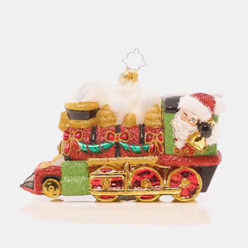 Video - Ornament Description - Steaming Towards Christmas: Full steam ahead! Christmas is almost here and Santa has no time to waste. He's taking a speedy train to get there in haste! This video shows the ornament spinning slowly. 