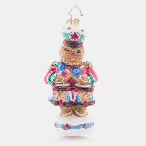 Video - Ornament Description - Drumroll Please: A gingerbread guard gallantly protects the candy castle, ensuring that it outlasts hungry hands of good little girls and boys before Christmas day. The video shows this ornament slowly spinning. 