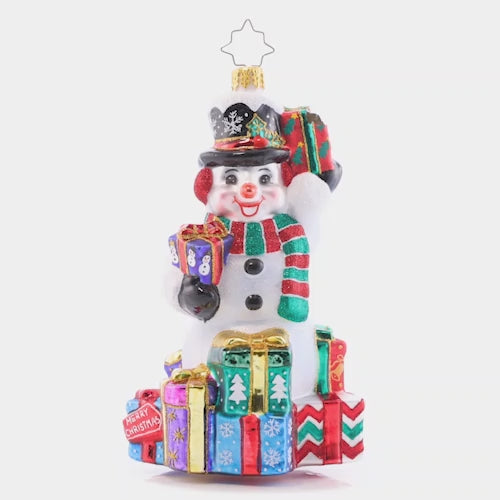 Video - Ornament Description - Wrapped And Ready Snowman: This festive snowman has a gift giving gameplan. He'll show up at your door to spread Christmas cheer galore. This video shows the ornament spinning slowly. 