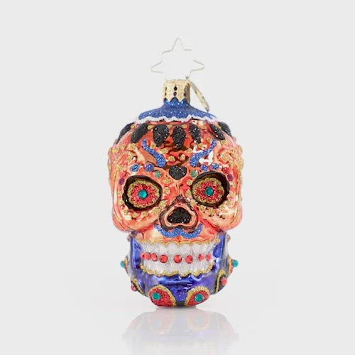 Video - Ornament Description - Color Calavera Gem: This itty bitty sugar skull knows how to stand out from the crowd. Adorned with jewels and sparkle he makes his culture proud!