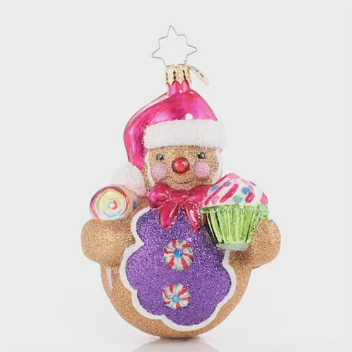 Video - Ornament Description - Roly-Poly Treat Tester: Cupcakes and lollies and peppermints, oh my! This gingerbread man knows there is no such thing as too many sweets. This video shows the ornament spinning slowly, 