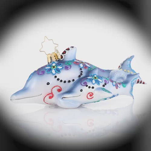 Video - Ornament Description - Swimming Through Florals: This pair of playful dolphins has been gussied up in their finest festive florals of the season. Now they are off to play in the waves! This video shows the ornament spinning slowly. 