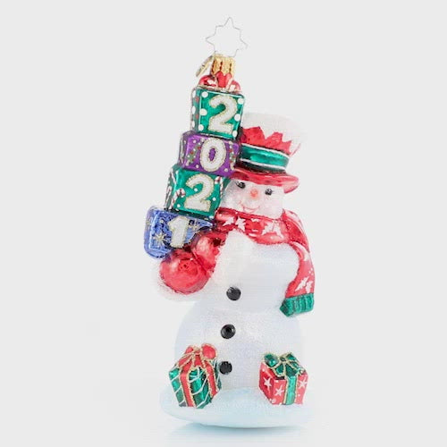 Video - Ornament Description: 2021 Teetering Tower Of Treasures - His shopping is done and his presents are festively wrapped. Mr. Snowman is ready for any and every celebration of the 2021 Christmas season!