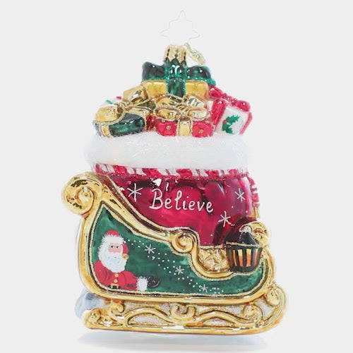 Video - Ornament Description - Christmas Magic Sleight: Painted in the rich colors of the season and bursting with Christmas treasure, the sight of this gilded sleigh is enough to make a believer out of even the most stubborn skeptic!