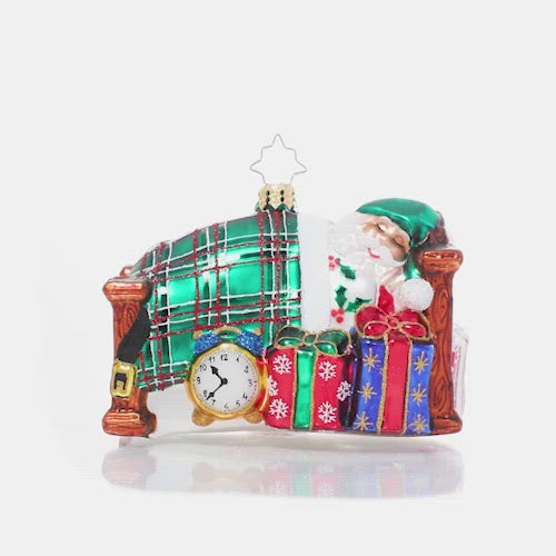Video - Ornament Description - Catching Z's Mr. Claus: The holiday season is a busy one, and no one knows that better than Santa Claus! After his last Christmas Eve delivery is complete, he settles in for a well-deserved long winter's nap.