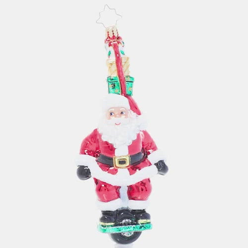 Video - Ornament Description - One Wheelin' Santa: Proving you're never too old to learn new tricks, Santa expertly rides a single wheel while balancing a stack of gifts on his head. Is there nothing this guy can't do? This video shows the ornament spinning slowly. 