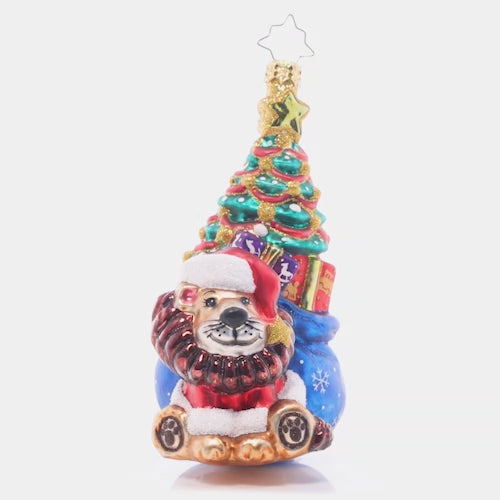 Video - Ornament Description - Cub's First Christmas: This brave little lion cub has a bag full of fun trailing behind him, ready to make baby's first Christmas extra special! The ornament spins slowly in the video. 